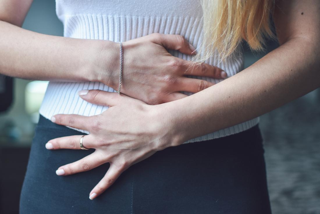 https://cdn-prod.medicalnewstoday.com/content/images/articles/325/325379/woman-holding-her-stomach-due-to-symptoms-of-liver-metastases.jpg